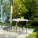 Boxhill's Area Outdoor Aluminum Dining Table White Lifestyle image at the garden