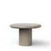 A minimalist round concrete dining table made of textured concrete, featuring a thick cylindrical base and a matching round tabletop, shown against a plain white background.
