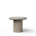 A minimalist concrete round dining table with a round top and cylindrical base in a light gray color, shown on a solid white background.