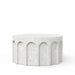 Modern white speckled round concrete outdoor coffee table with arches design on a white background