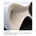 Close-up of a sculptural white resin in-pool lounge chair or stool edge with curved lines and a dark textured surface visible in the background, captioned as UV-stable resin crafted for 20,000 hours of direct sunlight.