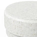 Close-up of a white speckled round concrete outdoor coffee table on a white background 
