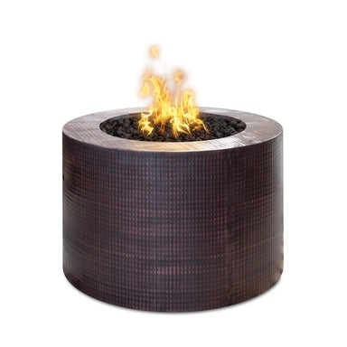 Dark brown hammered Copper outdoor metal round fire pits with lava rocks and flames on top