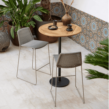 Boxhill's Breeze Bar Stackable Chair grey lifestyle image with round table