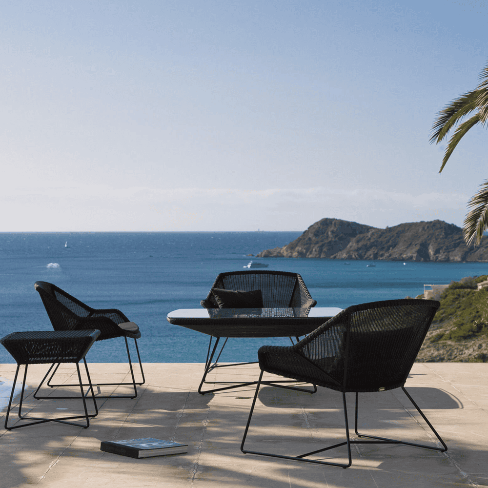 Boxhill's Breeze Outdoor Side Table Black lifestyle image with Breeze Lounge Chair and a table