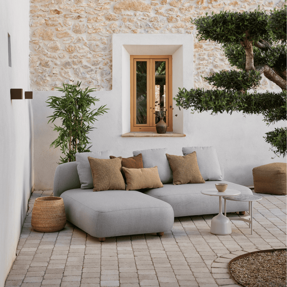 Boxhill's Capture 2-Seater Outdoor Sofa Module lifestyle image with pillows on top