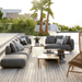 Boxhill's Capture Outdoor Corner Sofa with Chaise Lounge lifestyle image on wooden platform beside the pool