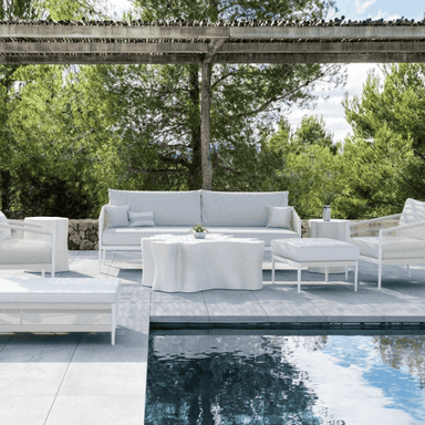 Boxhill's Catalina 3 Seat Outdoor Sofa Sand lifestlye with Daintree Coffee Table, Daintree Side Table, and Catalina Ottoman