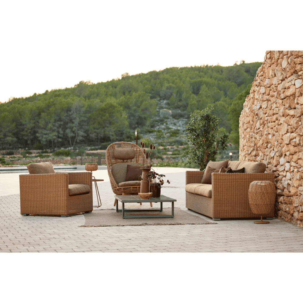 Boxhill's Chester Lounge Weave Coastal Chair Natural lifestyle image with Chester 3-Seater Coastal Sofa with mountain at the back