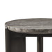 Close up view of a dark gray round patio side table with textured top on a white background