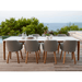 Boxhill's Choice Outdoor Dining Chair Teak Legs lifestyle image with Aspect Dining Table on wooden platform beside the pool