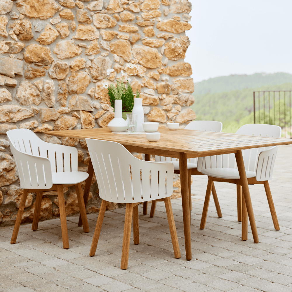 Boxhill's Choice Outdoor Dining Chair Teak Legs lifestyle image with dining table at patio