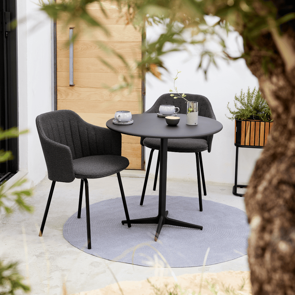 Boxhill's Choice Outdoor Dining Chair Warm Galvanized Steel Legs lifestyle image with Drop Round Cafe Table