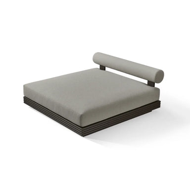 Modern minimalist gray cushioned outdoor daybed with a cylindrical backrest and dark aluminum base.