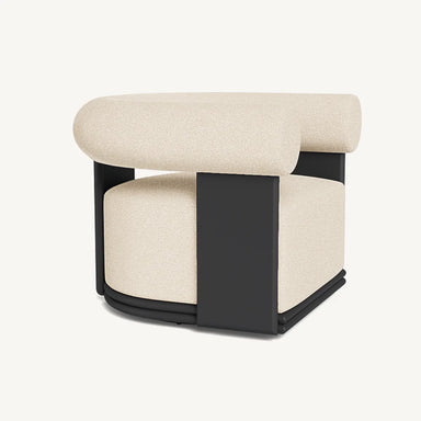 Side angle view of contemporary light beige outdoor swivel lounge chair with rounded back bolster and  black aluminum frame.