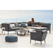 Boxhill's Conic Lounge Chair Grey lifestyle image with Conic Module Sofa with a woman sitting down at seafront