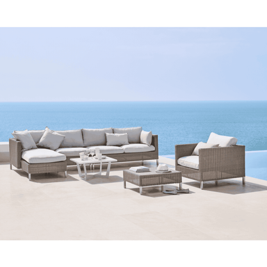 Boxhill's Connect Module Sofa lifestyle image with other module sofa, Connect Lounge Chair and Connect Footstool beside the pool
