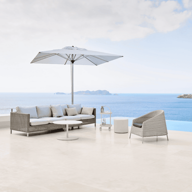 Boxhill's Connect Dining Lounge Combo E White Cushion lifestyle image with big umbrella sunshade beside the pool
