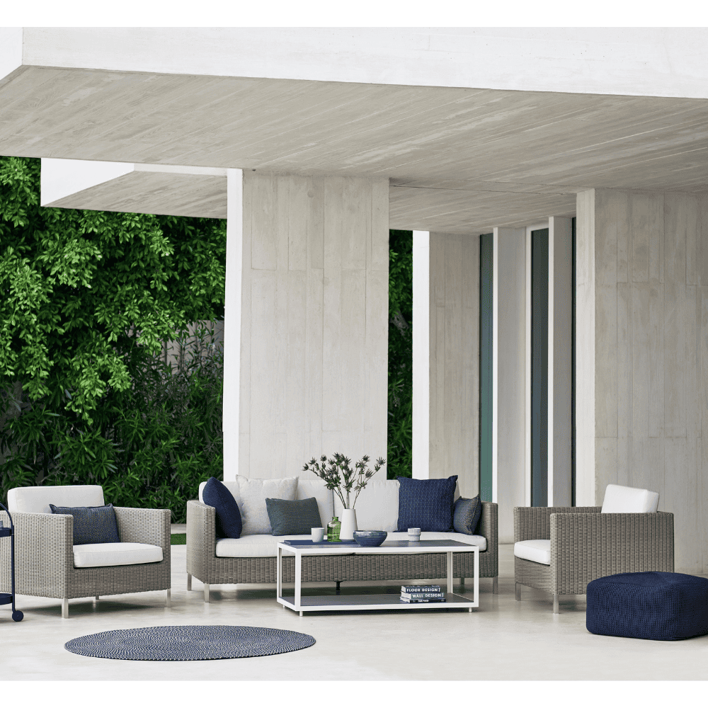 Boxhill's Connect Lounge Chair lifestyle image with Connect 3-Seater Weave Sofa at patio