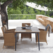Boxhill's Core Garden Dining Table lifestyle image with Hampsted Outdoor Dining Armchair beside the tree