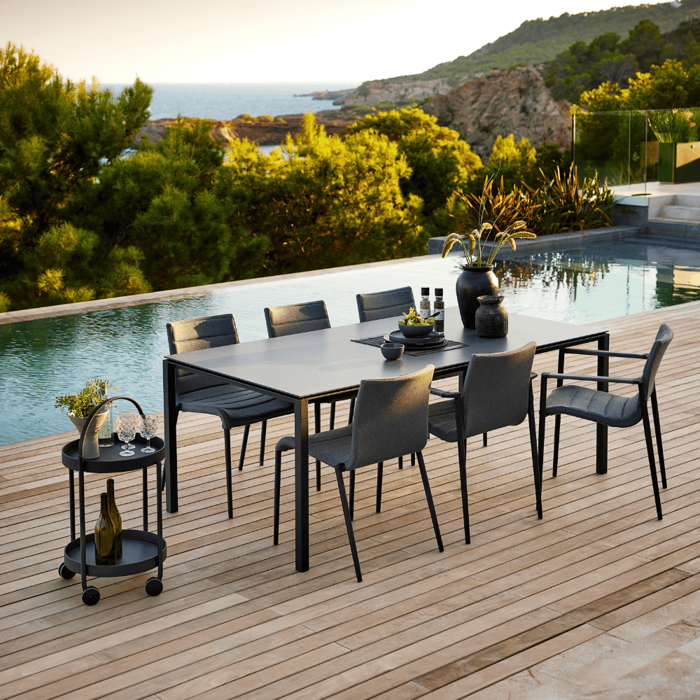 Boxhill's Core Patio Dining Chair (Set of 2) Grey lifestyle image with dining table beside the pool