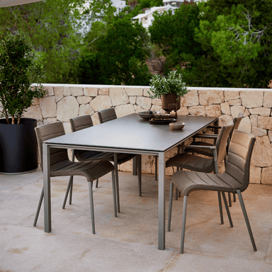 Boxhill's Core Patio Dining Chair (Set of 2) Taupe lifestyle image with dining table at patio