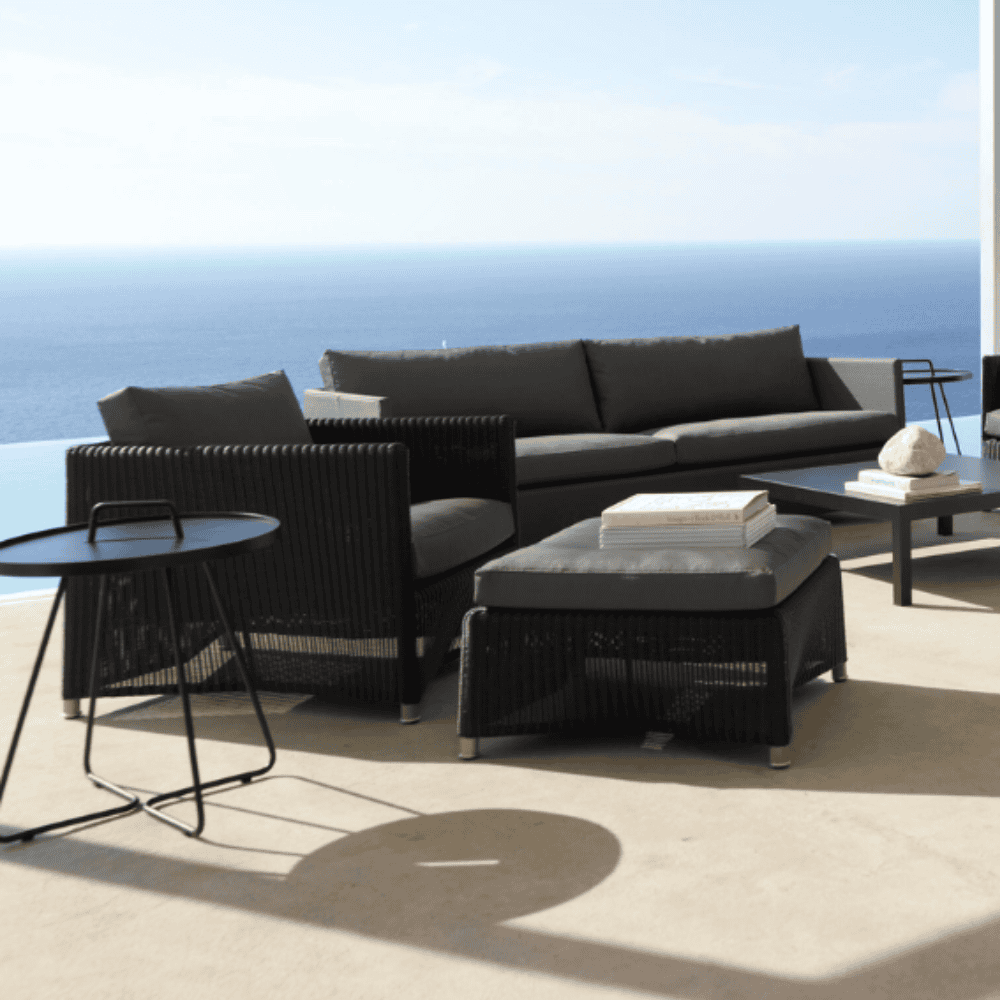 Boxhill's Diamond Weave Lounge Chair lifestyle image with Diamond 3-Seater Weave Sofa, Diamond Weave Footstool and side tables beside the pool