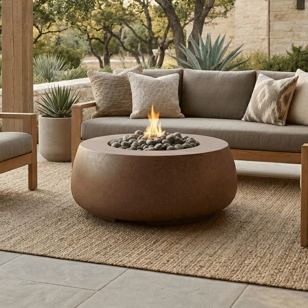 Outdoor patio with a fire pit table and cushioned sofa