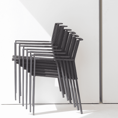 Boxhill's Edge Stackable Outdoor Armchair lifestyle image piled up side view