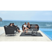 Boxhill's Mega Modern Outdoor Lounge Chair lifestyle image beside the pool with Mega Modern Outdoor 2-Seater Sofa, 2 Level Coffee Table and 2 couples sitting down having a chat
