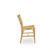 Natural rattan outdoor dining side chair in a light tan finish with an open slatted back viewed from the side.