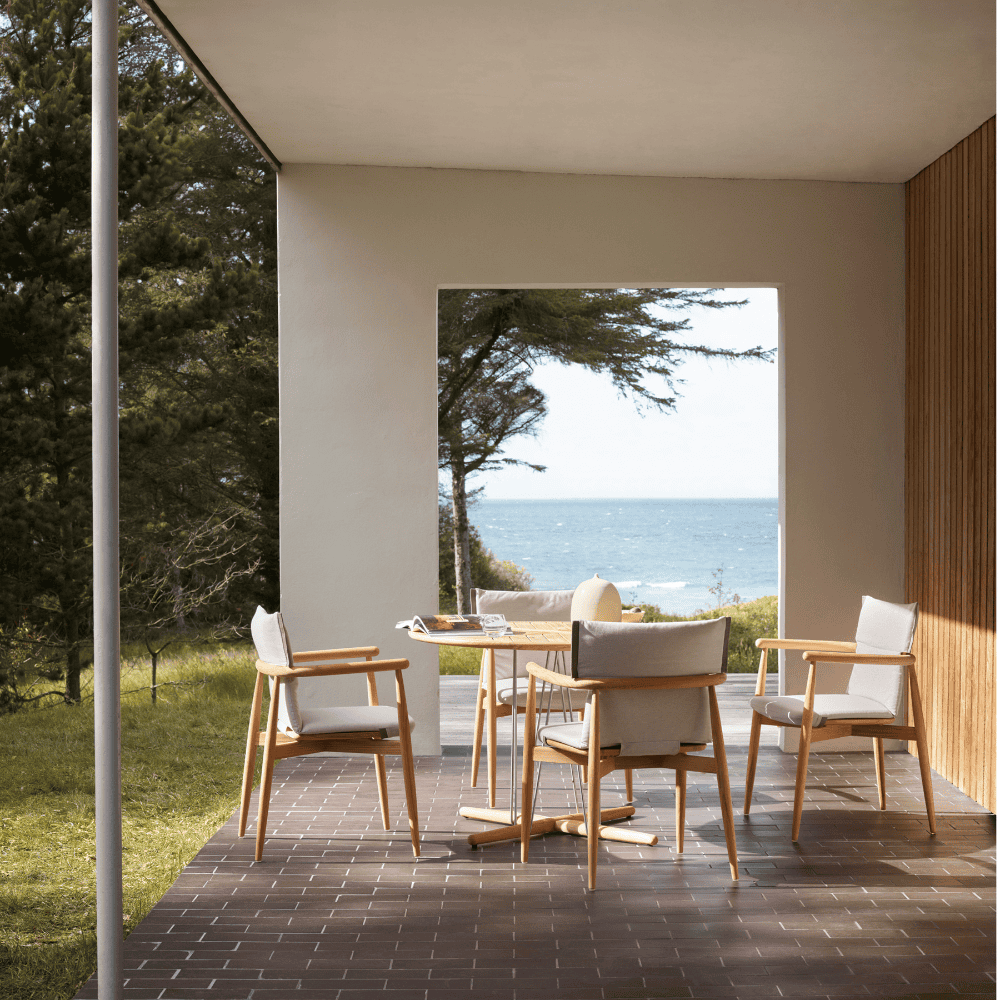 boxhill's Embrace Outdoor Dining Table with embrace dining chair in a patio