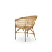 Natural rattan outdoor dining side chair in a light tan finish viewed from the rear with an open woven frame.