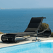 Boxhill's Escape Pool Side Sunbed Black Weave with Black Cushion lifestyle image beside the pool