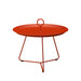 Orange metal round outdoor tray table with circular handle at the center on a white background