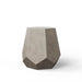 Gray textured geometric concrete outdoor side table or stool with faceted design on a plain white background