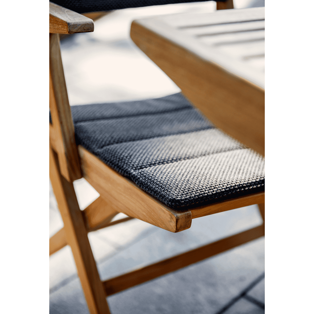 Boxhill's Flip Folding Outdoor Teak Dining Armchair with Dark Grey Cushion close up view