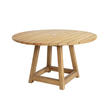 Natural wooden outdoor round dining table with a slatted top, central umbrella hole and four-legged base.