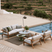 Boxhill's Glaze Outdoor Round Coffee Table lifestyle image with 3 seater sofa and 2 lounge chair beside the pool