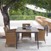 Boxhill's Hampsted Outdoor Dining Armchair lifestyle image with Core Garden Dining Table beside the tree at patio
