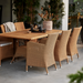 Boxhill's Hampsted Outdoor Dining Armchair lifestyle image with teak dining table at patio