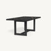 A stylish table with a black ceramic tabletop and a metallic base for support.