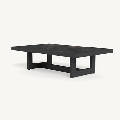 A black aluminum frame rectangular patio coffee table with a ceramic table top surface and a square base design.