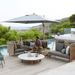 Boxhill's Hyde Luxe Tilt Aluminum Parasol | 3x3 m lifestyle image with Arch Sofa Collection at poolside with a man and a woman sitting down