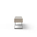 Side-view of gray concrete outdoor bench with black metal legs on a white background