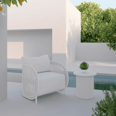 Boxhill's Kamari Outdoor Club Chair lifestyle image with Palma Side Table at pool side