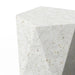 Close-up of white specked concrete outdoor side table with geometric, hexagonal-shaped on a white background