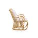 Natural rattan outdoor lounge chair viewed from the side with white cushions and curved base rails.