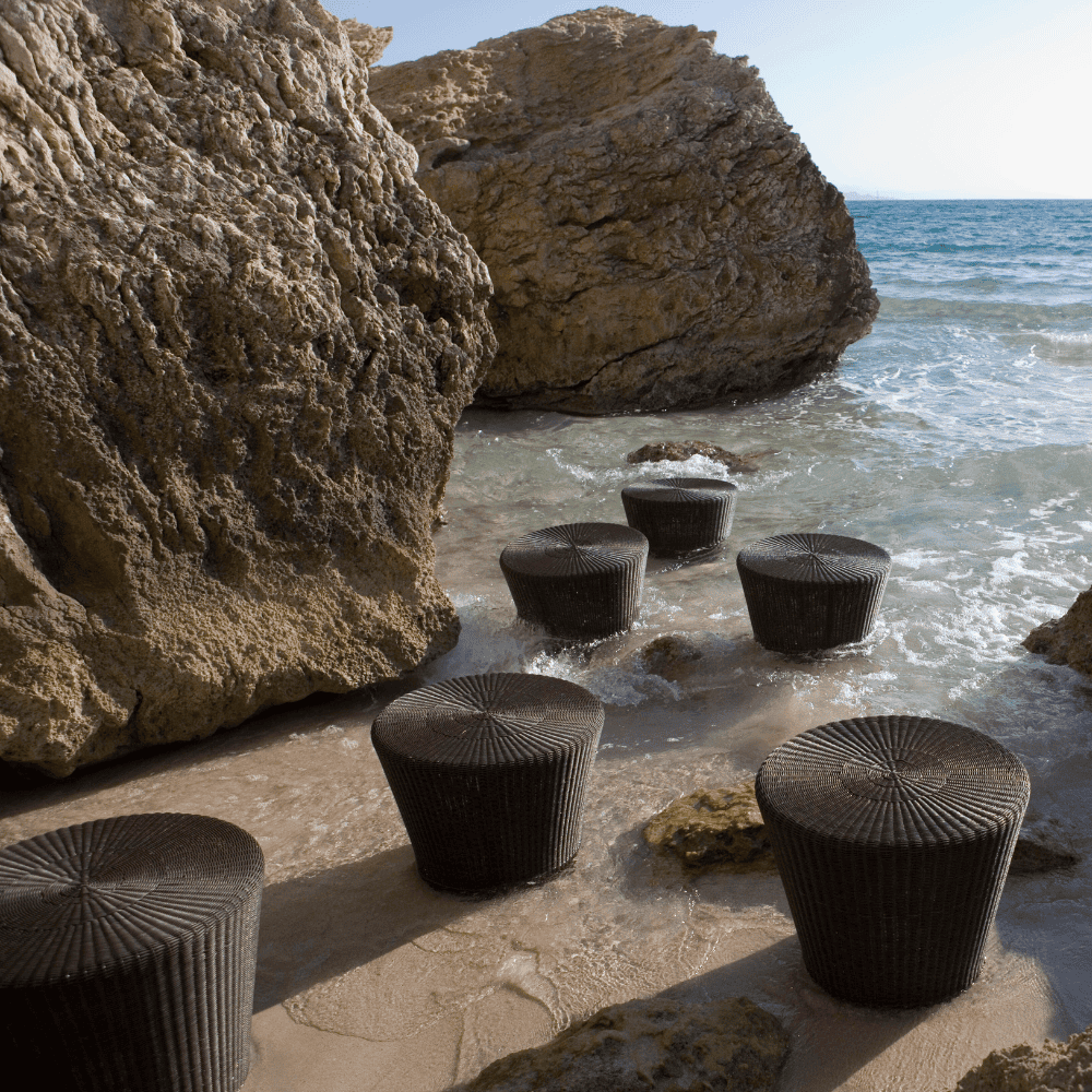 Boxhill's Boxhill's Kingston Outdoor Footstool | Side Table lifestyle image at rocky beach shore