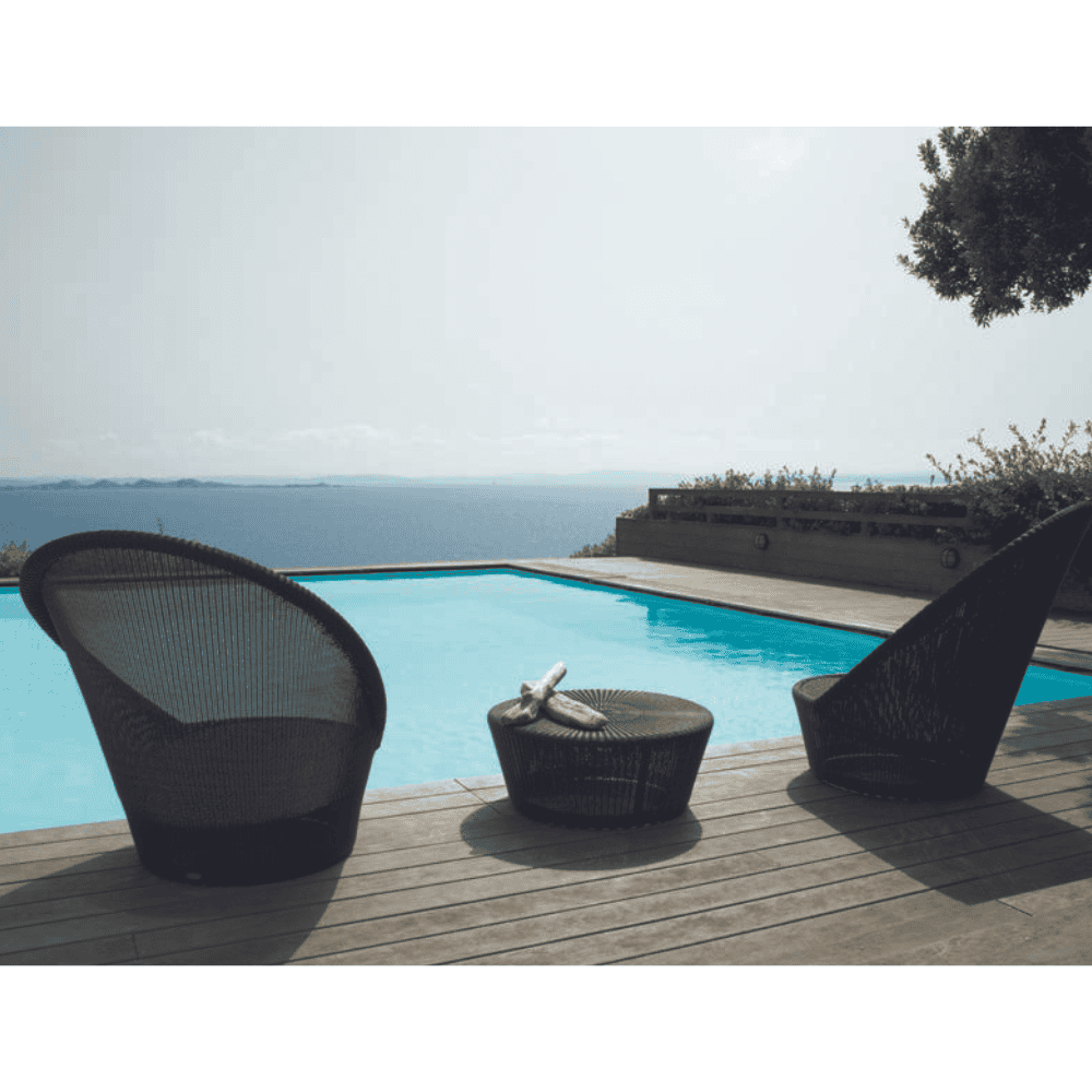 Boxhill's Kingston Outdoor Footstool | Side Table lifestyle image with Kingston Sunchair Lounge with Wheels on wooden poolside